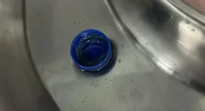 Cold drink lid stuck in throat